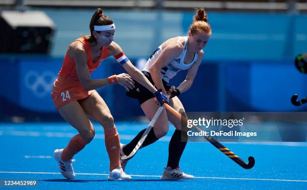 Eva de Goede of Netherlands and Sarah Jones of Great Britain battle for the ball in the Women's Semifinal Hockey match between Netherlands and Great...