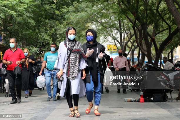 People wear face masks as a measure against coronavirus pandemic in their daily lives Grand Bazaar in Tehran, Iran on August 04, 2021. Coronavirus...