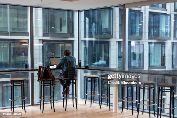 An office worker at a bar seat in a WeWork co-working office space in the Waterloo district in London, U.K. On Monday, Aug. 2, 2021. A survey this...
