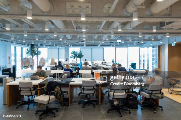 Office workers at desks in a WeWork co-working office space in the Waterloo district in London, U.K. On Monday, Aug. 2, 2021. A survey this month...