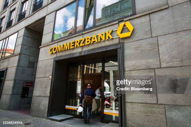 Customers enter a Commerzbank AG bank branch in Berlin, Germany, on Wednesday, Aug. 4, 2021. Commerzbank saw earnings hit by a series of one-time...