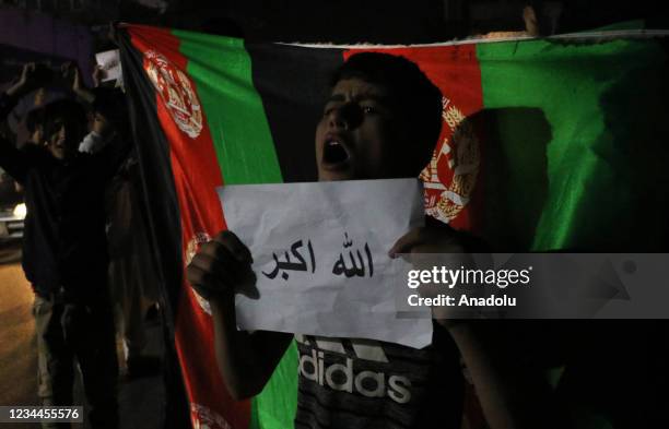 Afghan people shout slogans against the bomb attack as they gather on the streets of Kabul, Aghanistan on August 03, 2021. Thousands Afghan chanting...