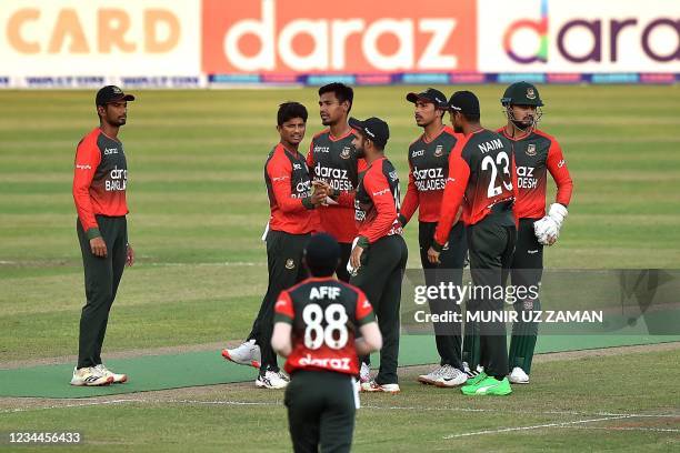 Bangladesh's cricketers celebrate after the dismissal of Australia's Alex Carey during the second Twenty20 international cricket match between...