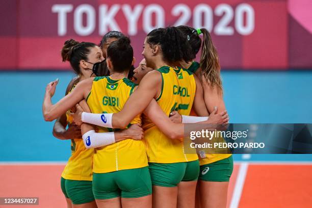 Brazil's players react after a point in the women's quarter-final volleyball match between Brazil and Russia during the Tokyo 2020 Olympic Games at...