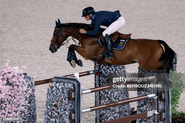 Sweden's Peder Fredricson riding All In competes in the equestrian's jumping individual finals during the Tokyo 2020 Olympic Games at the Equestrian...