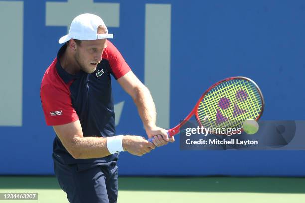 Denis Kudla of the United States returns a shot during a match against Taylor Fritz of the United States on Day 5 during the Citi Open at Rock Creek...