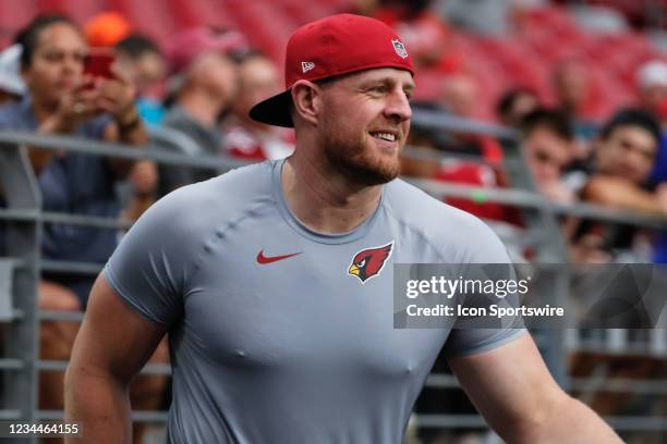 Arizona Cardinals defensive end J.J. Watt smiles on the sideline during Arizona Cardinals training camp on August 4, 2021 at State Farm Stadium in...