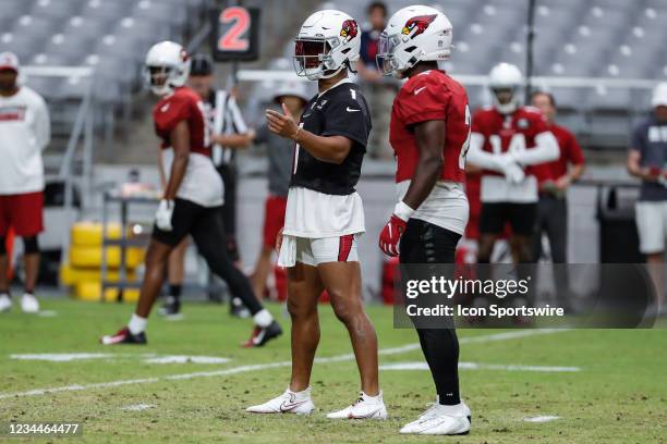 Arizona Cardinals quarterback Kyler Murray directs Arizona Cardinals running back Chase Edmonds during Arizona Cardinals training camp on August 4,...