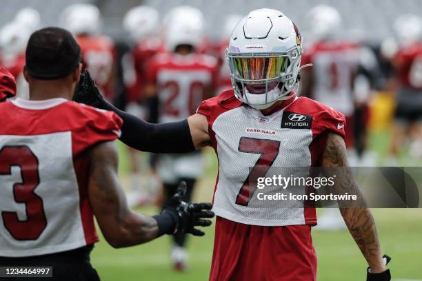 Arizona Cardinals cornerback Byron Murphy high fives Arizona Cardinals strong safety Budda Baker during Arizona Cardinals training camp on August 4,...