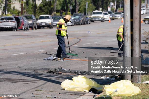 Burbank, CA Debris from a car crash are clean from Gleanoaks Blvd. In Burbank, Wednesday, August 2021. Three people were killed and at least two...