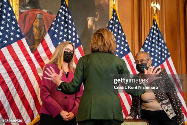 Speaker of the House Nancy Pelosi speaks with Rep. Jennifer Wexton and Del. Eleanor Holmes Norton in the Rayburn room on the House Side of the U.S....