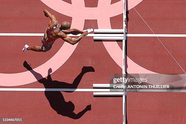 An overview shows Canada's Damian Warner as he competes in the men's decathlon 110m hurdles during the Tokyo 2020 Olympic Games at the Olympic...