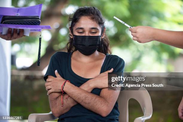 Health worker prepares a dose of the AstraZeneca vaccine during a vaccination day on August 4, 2021 in Mexico City, Mexico.