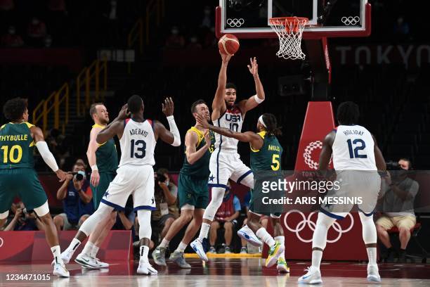S Jayson Tatum goes to the basket past Australia's Nic Kay in the men's semi-final basketball match between Australia and USA during the Tokyo 2020...