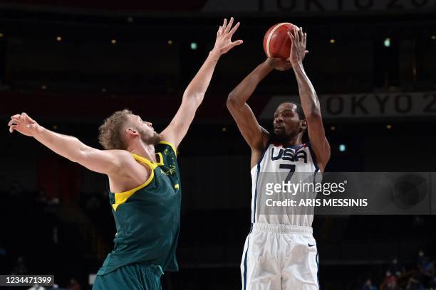 S Kevin Wayne Durant takes a shot past Australia's Jock Landale in the men's semi-final basketball match between Australia and USA during the Tokyo...