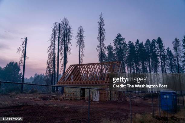July 29: Smoke from the Dixie Fire fills the sky above a new construction in Paradise, California, July 30, 2021 .