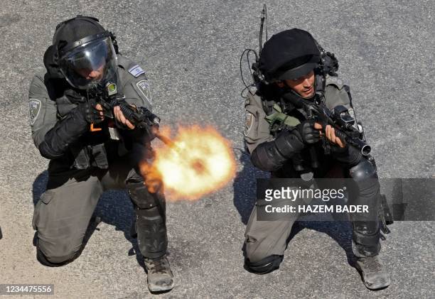 Israeli border guards fire rubber bullets and tear gas during clashes with locals in the village of Sair northeast of Hebron in the occupied West...