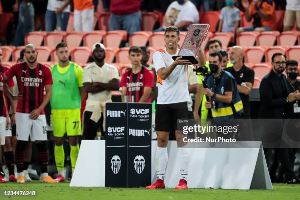 Gabriel Paulista of Valencia CF show Toronja trophy after &quot; Taronja Trophy &quot; match between Valencia CF and AC Milan at Mestalla Stadium on...