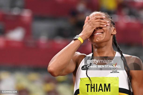 Belgium's Nafissatou Thiam celebrates after winning the women's heptathlon during the Tokyo 2020 Olympic Games at the Olympic Stadium in Tokyo on...
