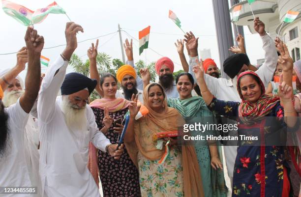 Father Baldev Singh , mother Sukhjinder Singh , Sister Gurpreet Kaur and relatives of India's field hockey player Gurjant Singh celebrate as India's...