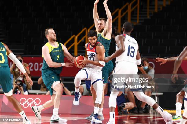 Jayson Tatum of the USA Men's National Team handles the ball as Joe Ingles of the Australia Men's National Team and Nic Kay of the Australia Men's...