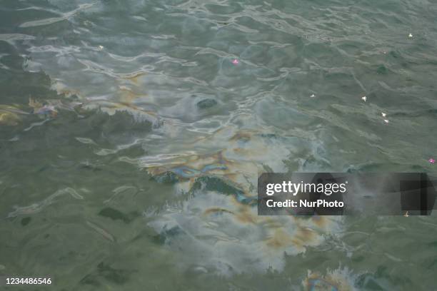 Fuel seeps out of the submerged wreckage of the U.S.S. Arizona at Pearl Harbor in Hawaii, USA.