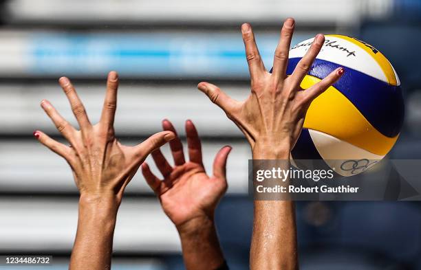 Tokyo, Japan,Thursday, August 5, 2021 - Alix Klineman stretches her fingers to the limit in an attempt to block the spike of Switzerlands Joana...