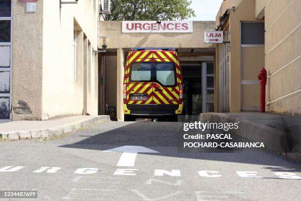 Firemen arrive with a patient at the emergency department of the hospital of Bastia on the French Mediterranean island of Corsica on August 5, 2021....