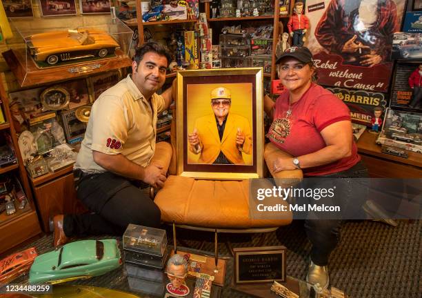 Jerod Barris and his mother Joji Barris-Pastor, pose next to a portrait of custom car designer George Barrris displayed inside a meeting room that...