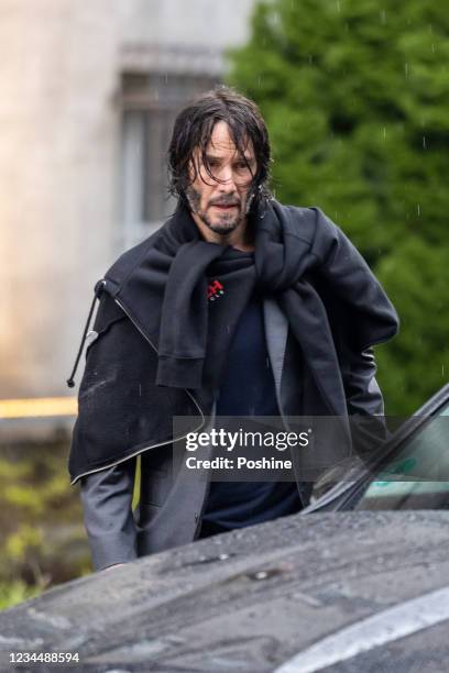 Keanu Reeves is seen leaving his hotel to go to the set of "John Wick: Chapter 4" on August 5, 2021 in Berlin, Germany.