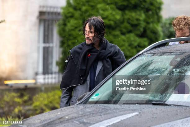 Keanu Reeves is seen leaving his hotel to go to the set of "John Wick: Chapter 4" on August 5, 2021 in Berlin, Germany.