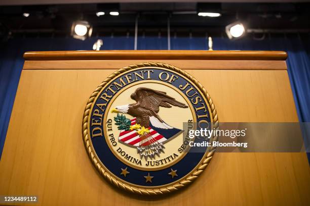 The U.S. Department of Justice seal on a podium in Washington, D.C., U.S., on Thursday, Aug. 5, 2021. The Justice Department has opened an...