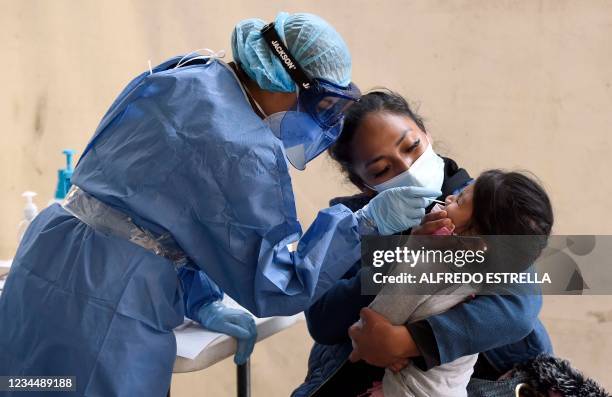 Nurse from the local government performs a rapid test to a child to detect Covid-19 in the municipal esplanade of Ciudad Nezahualcoyotl, state of...