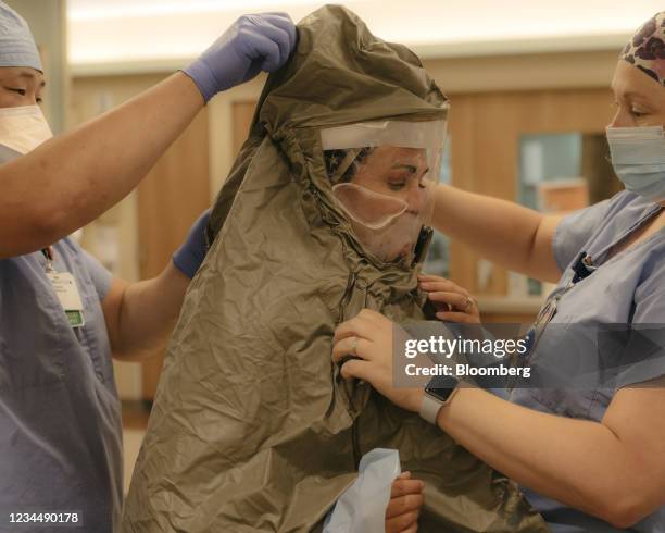 Nurse prepares to enter a room to treat a patient in the ICU Covid-19 ward at NEA Baptist Memorial Hospital in Jonesboro, Arkansas, U.S., on...