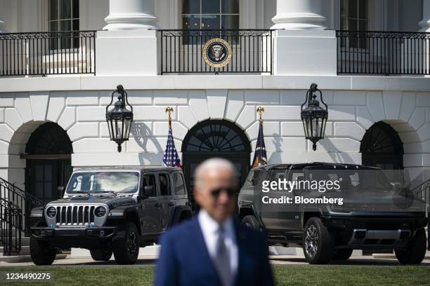 Jeep and Hummer behind U.S. President Joe Biden during an event on the South Lawn of the White House in Washington, D.C., U.S., on Thursday, Aug. 5,...