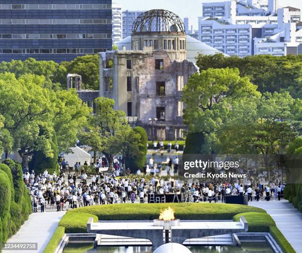 People pray at the Peace Memorial Park in Hiroshima, western Japan, on Aug. 6 the 76th anniversary of the U.S. Atomic bombing of the city.
