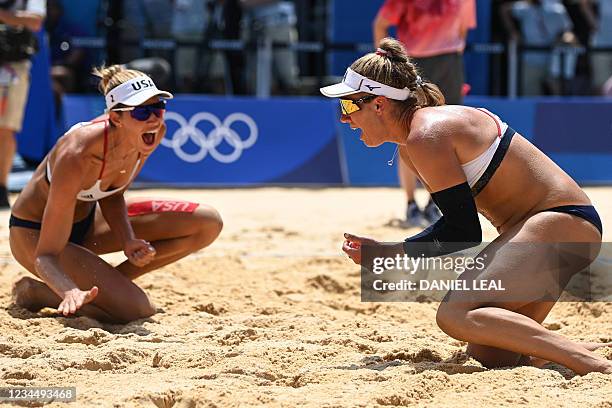 S April Ross and Alix Klineman celebrate winning their women's beach volleyball final match between Australia and the USA during the Tokyo 2020...