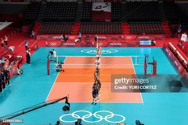 Players line up before the women's semi-final volleyball match between USA and Serbia during the Tokyo 2020 Olympic Games at Ariake Arena in Tokyo on...