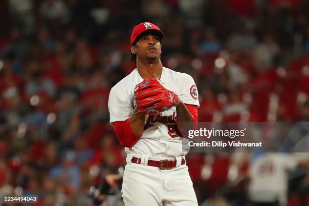 Alex Reyes of the St. Louis Cardinals reacts after walking three consecutive batters against the Atlanta Braves in the eighth inning at Busch Stadium...