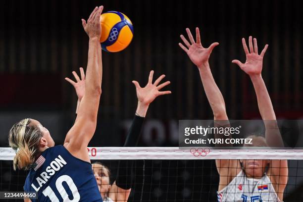 S Jordan Larson spikes the ball in the women's semi-final volleyball match between USA and Serbia during the Tokyo 2020 Olympic Games at Ariake Arena...