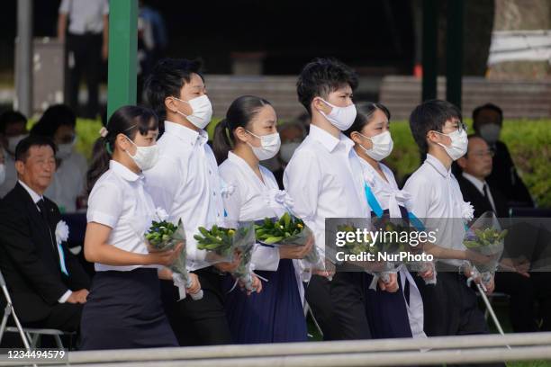 Students attend a commemoration in Peace Memorial Park, as Hiroshima marks the 76th anniversary of the atomic bombing, on August 6, 2021 in...