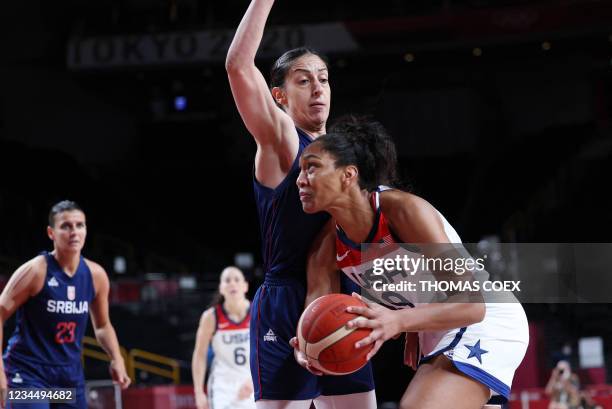 S A'ja Wilson goes to the basket past Serbia's Jelena Brooks in the women's semi-final basketball match between USA and Serbia during the Tokyo 2020...