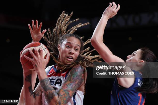 S Brittney Griner defends the ball from Serbia's Dragana Stankovic fight for the ball in the women's semi-final basketball match between USA and...