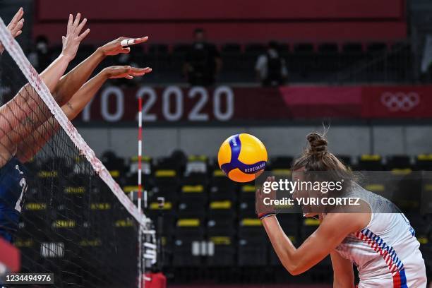 Serbia's Bojana Milenkovic reacts after her shot was blocked by USA's Haleigh Washington in the women's semi-final volleyball match between USA and...