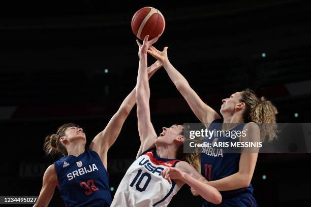 S Breanna Stewart , Serbia's Tina Krajisnik and Aleksandra Crvendakic jump for the ball in the women's semi-final basketball match between USA and...