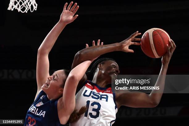 Serbia's Angela Dugalic fights for the ball with USA's Sylvia Fowles in the women's semi-final basketball match between USA and Serbia during the...