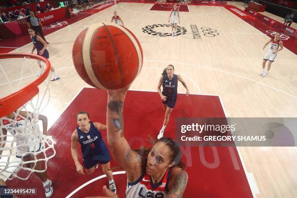S Brittney Griner goes to the basket past Serbia's Nevena Jovanovic in the women's semi-final basketball match between USA and Serbia during the...