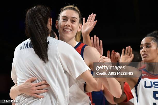 S players celebrate their win in the women's semi-final basketball match between USA and Serbia during the Tokyo 2020 Olympic Games at the Saitama...