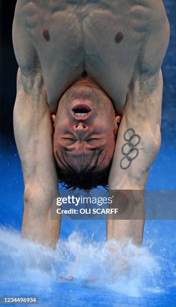 Britain's Thomas Daley competes in the preliminary round of the men's 10m platform diving event during the Tokyo 2020 Olympic Games at the Tokyo...