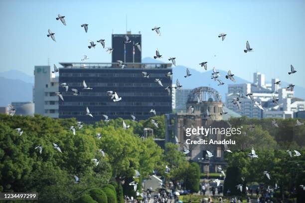 Doves are released as a sign of peace during the Hiroshima Peace Memorial Ceremony at the Hiroshima Peace Memorial Park on the day of the 76th...